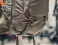 On the underside, straps hold the pads during the ascent or perhaps the sleeping mat for the summit bivouac.