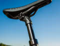 Lowerable seat post with internally routed cable