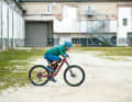 1. bend:

 Bend low over the handlebars to create enough tension.