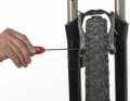 2. INCREASE TENSION To adjust the spring tension, each V-brake has an adjusting screw on the side at right angles to the mounting. Simply tighten the screw on the non-moving side in small increments using the appropriate Allen key or Phillips screwdriver.
