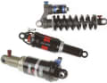 WHICH DAMPER?

A basic distinction is made between two types: Steel spring shocks such as the Fox "Vanilla RC" (top) and air spring shocks such as the DT Swiss "210L" (centre). Coil spring shocks are particularly recommended for downhill riders due to their response behaviour and even spring characteristics. Long-distance bikers and racers appreciate the unbeatably low weight of air shocks. They also often offer a lockout for uphills.

The latest technology: platform shocks such as the Manitou "Swinger" (below), which automatically suppresses bobbing when pedalling.