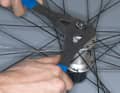 Step 2: Adjust hub play

Reassemble the axle by screwing the bearing cone, spacer discs and lock nut back onto the axle. Counter these slightly. By slowly screwing the right and left lock nuts together, you can gradually adjust the bearing play. The axle should run smoothly but no longer have any lateral play. 