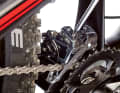 To set the lower limit, shift to the small chainring and largest sprocket. Then use the L-screw to adjust the inner guide plate so that it just does not touch the chain.