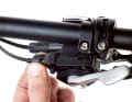 Use the tension screw on the shift lever to increase or decrease the tension on the shift cable. Shift to the smallest sprocket for adjustment.