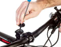 Clamp the bike in an assembly stand and remove the front wheel. Then unscrew the headset cap using an Allen key.