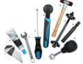 1. Allen key, 2. assembly grease, 3. 15mm spanner, 4. screwdriver, 5. bottom bracket tool, 6. rubber mallet, 7. press-in tool, 8. knock-out tool, 9. crank cap tool