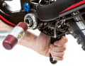 The left-hand crank can then be easily removed from the axle. You can carefully tap the right-hand crank out of the bottom bracket with a rubber mallet.