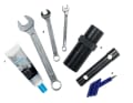 YOU NEED THESE TOOLS: 1. bearing grease, 2. 7 mm/10 mm/17 mm open-end spanner, 3. cone tool, 4. mandrel