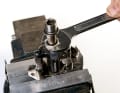 SMALL SERVICE: Often the bearings simply no longer run cleanly or the bearing cone is incorrectly adjusted. You can rectify this problem in just a few steps.

 Clamp the pedal body in a vice. You can now unscrew the axle from the pedal body using a 17 mm open-end spanner.