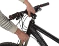 Now hold the fork firmly with one hand and pull the stem off the steerer tube. The fork usually detaches itself from the head tube when you pull it off. The shift and brake cables are usually long enough to allow you to pull the handlebars and fork off easily. Make sure that the handlebars do not scratch the frame.