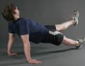 Strengthen the back and hip extensors as well as the oblique abdominal muscles. Sit down with your legs straight. Place your hands next to your buttocks with your fingers pointing slightly outwards. Push yourself up. Pull your shoulder blades back towards your spine. Your heels and shoulders should form a straight line. If you want to increase the load, you can lift one leg. Caution: do not allow the hips to tilt.