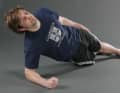 Strengthen the abdominal and back muscles. Lie on your side and on your elbows. Push yourself off the floor. Keep your elbows and shoulders level. Pull in your belly button to prevent a hollow back. Make sure that your body axis is straight.