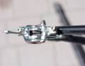 It is best to use a thin piece of household rubber to hold the fork spanner in place. Now carefully pump the brake lever until the slave pistons are in contact with the fork spanner. The pistons now protrude about four millimetres from the housing.