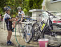 Practice makes perfect: Karl's son Luis washes the men's toys. Dad Platt cycles with his three children as often as he can.
