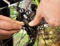 The derailleur cable is broken and you have no tools with you Push a small stick or a flat object into the parallelogram of the derailleur. This will allow you to limit the swivelling range to any gear. The same works for the front derailleur.