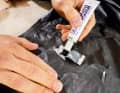 2. then apply a little textile adhesive to the detached areas. Press the glued area firmly together for two minutes and then leave the textile adhesive to work for 12 to 24 hours.