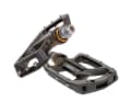 Shimano Saint PD-MX80

www.paul-lange.de

 Price: 69.95 euros - Weight*: 490 grams - Dimensions: 89x100x18 mm

 Thor seems to have hammered the Saint pedals out of an aluminium block with his own hands: solid, robust and indestructible - but at 490 grams, they are as far removed from "light" as butter is from diet margarine. Once you have removed the small washers from under the pins, the large, concave pedal body provides a secure footing. Nevertheless, the seven pins do not offer ultimate grip. Shimano's conical bearings are considered the epitome of durability and are very easy to maintain. You can forgive the weight.

Conclusion: robust and low-maintenance pedal with acceptable grip.

Grip 4 out of 6 points

Footprint 5 out of 6 points