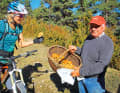 A little mushroom lore: Julia gets a taste of the day's haul from a local mushroom picker.