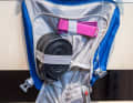 The tools are stored in the fold-down bottom compartment.