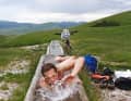 Self-catering hut Capanna Ghezzi with open-air bathtub.