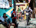 Everyone is beside themselves with excitement: When the bikers race through the alleyways of the favela, young and old go crazy.