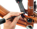 (1) Find a suitable location Find a suitable location for a cable opening and pre-corner. ATTENTION: Do not do this on carbon frames!