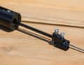 The spoke tensions the cable and thus tightens the damper. The design is deliberately kept simple so that the system functions with as little maintenance as possible.
