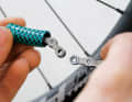 Threading: To thread the chain through the tube, it must be opened. If you have a chain lock, you have an advantage. Shimano chains must be riveted on and closed again with a rivet pin. With the right chain riveter and rivet pin, this is also no problem.