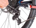 Wrap: Use the wrap screw to set how far the rear derailleur, and therefore the chain, wraps around the sprocket. To do this, shift to the largest sprocket and measure the distance between the upper guide roller and the tooth tips of the sprocket. For Sram 1x11 and 1x12 drivetrains, the distance should be 15 millimetres. The B Gap Adjustment Tool (see box on the right) makes the adjustment easier.