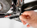 3. inner stop: Fit the chain. The screw labelled "L" ("L" for low, i.e. the low gears) is used to limit the pivoting range inwards. If the chain is on the small plate at the front and on the largest sprocket at the rear, it should just run past the inner guide plate without dragging.