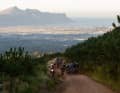 To escape the heat, at least partially, the participants start at dawn. This makes the brutal climbs a little more bearable and the pictures (here: view of Lourensford Wine Estate) even more epic.