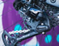 Selectable friction damper on the rear derailleur 