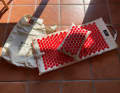 The OrthoMat is supplied in a linen bag and with an additional spiked cushion.