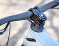 The cables run through the headset into the inside of the frame.