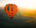 A scorcher: Elias Schwärzler became the first person to ride across the outer skin of a hot-air balloon, which was 100 degrees hot.