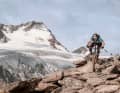 Biking away from the park trails. Here, bike celebrity Wyn Masters steers his enduro bike over slate slabs on the Long Trail Ferner in Sölden.