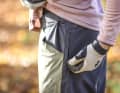 The two zip pockets face backwards towards the buttocks. We didn't find the orientation really practical