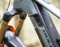 The lock and charging port are located under a cover flap in the down tube.