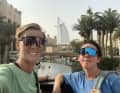 Poses in front of the Burj al Arab