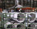 Des ébauches pliées à partir de profilés extrudés en aluminium attendent d'être anoblies en roues Campagnolo