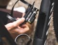 The down tube of the new Canyon Grail Race gravel bike conceals a storage compartment and tools.