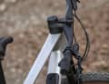 A steering stop is integrated to protect the cable and top tube.