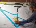 Old school: Richard designs classically on the drawing board instead of the computer. Swing arm and damper prototypes are made of cardboard.