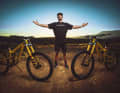 Two bikes, one rider: Clemens with his Rampage bikes. The importance of having a spare bike soon became apparent.