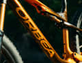 The flat structure in the top tube around the shock is designed to improve stiffness.