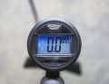The pressure gauge is located at the top of the tall cylinder, is easy to read and measures very accurately.