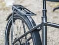 Instead of a completely separate component, Cube extends the frame to the rear and only attaches the platform. This looks well thought out and provides rigidity.