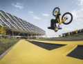 Front flips in succession: Danny rolls over the triple jump mat and somersaults forwards. Matching colours: mat and Santa Cruz bike.