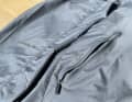The front pockets are large and you can warm your hands in them - but the small reflective strip on the left is more of an ornament.