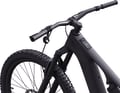The remote is attached wirelessly to the handlebars.